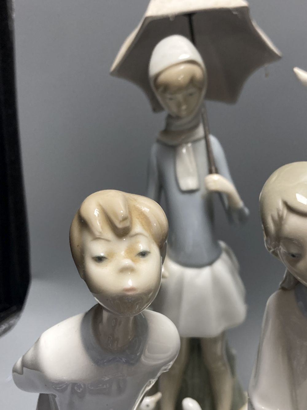 A collection of Lladro and Goebel porcelain figures and other items